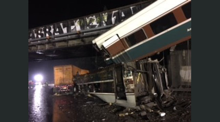 NTSB: Amtrak engineer missed speed-limit sign before train derailed