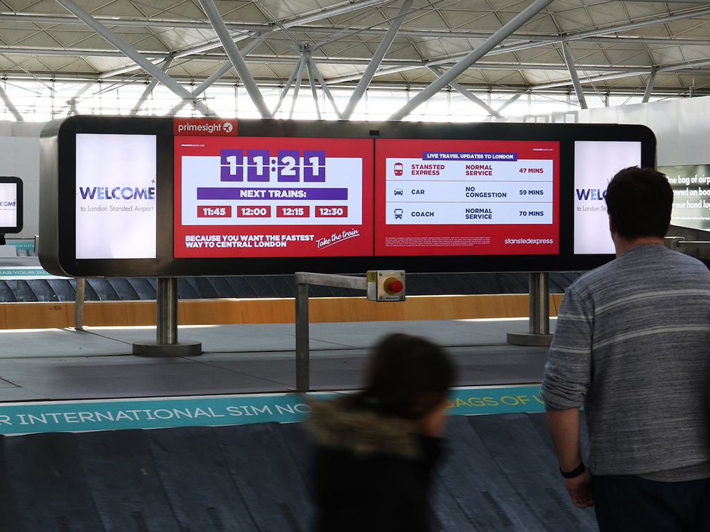 Travel information and adverts at Stansted Airport